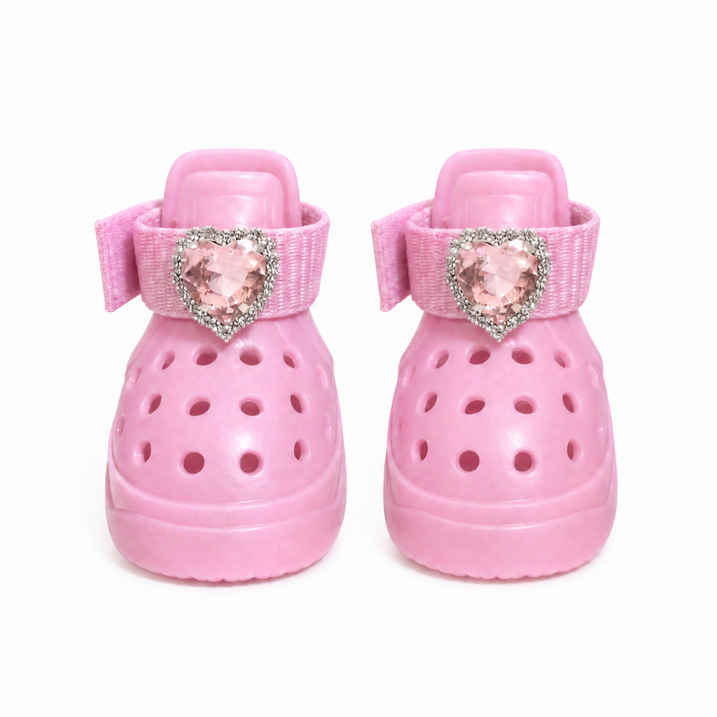 A pair of Blessingmychild stylish pink breathable dog sandals with diamond heart luxury emblems, white background