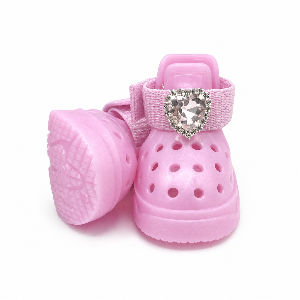 Close-up side view of Blessingmychild luxury pink dog crocs shoes with interchangeable crystal heart charm, white background