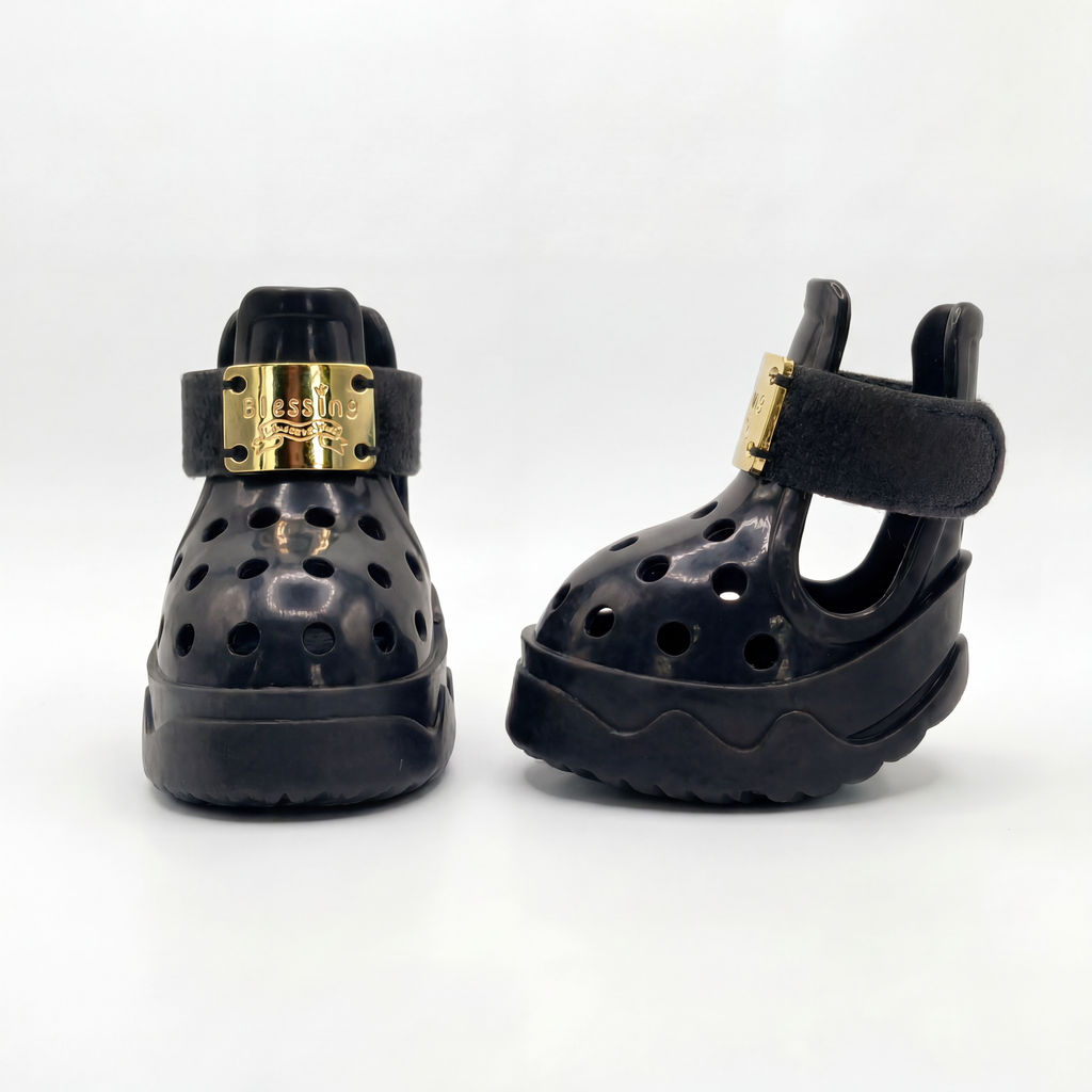 Side and profile view of a pair of Blessingmychild V1 limited edition knight black puppy shoes with premium gold hardware