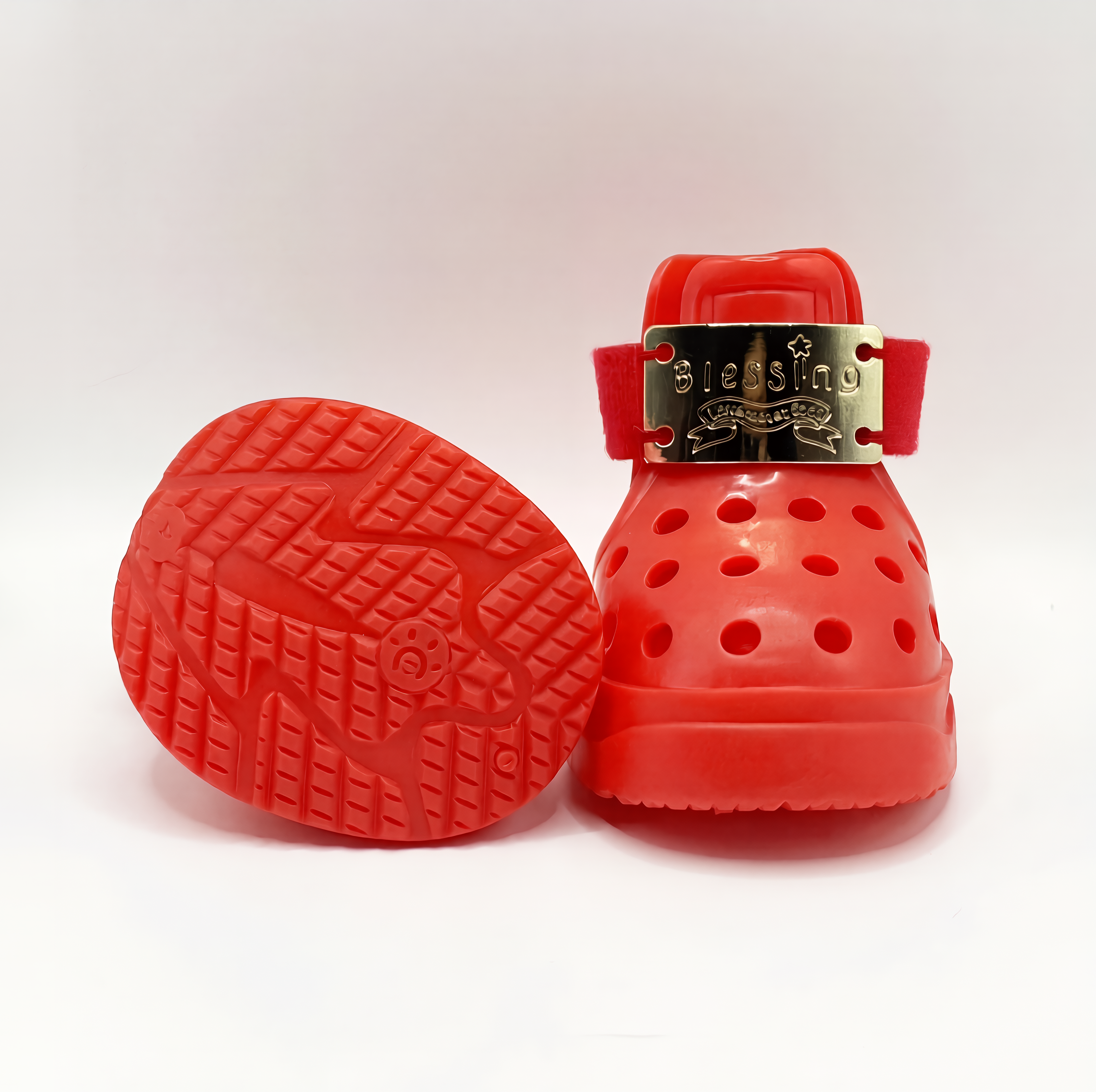 Close-up of Blessingmychild V1 red pet footwear demonstrating the durable non-slip grip patterned sole and breathable ventilation holes