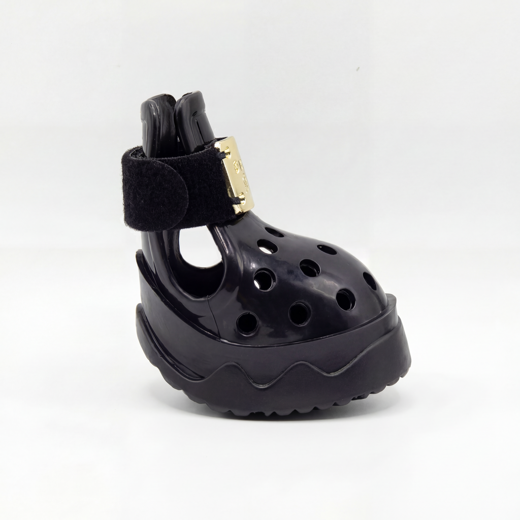 Side profile view of a single Blessingmychild V1 classic knight black dog shoe showcasing its breathable cutouts and luxury front gold hardware