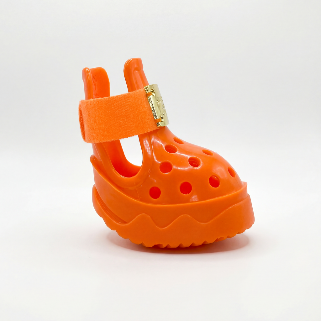 Side profile shot of Blessingmychild V1 limited edition Kelly Orange pet sandals with pristine engraved gold brand hardware
