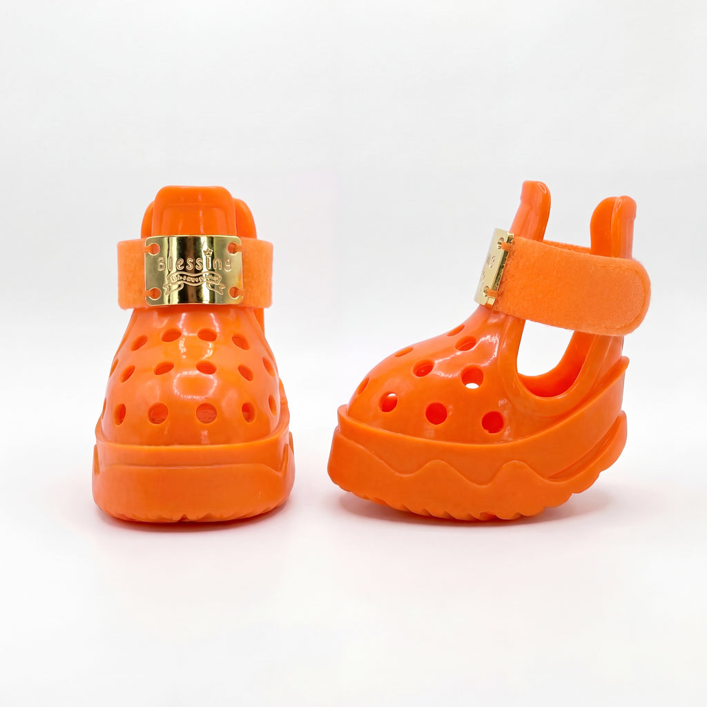 Side and rear angle of a pair of Blessingmychild V1 luxury orange dog shoes highlighting the secure ankle straps and breathable design