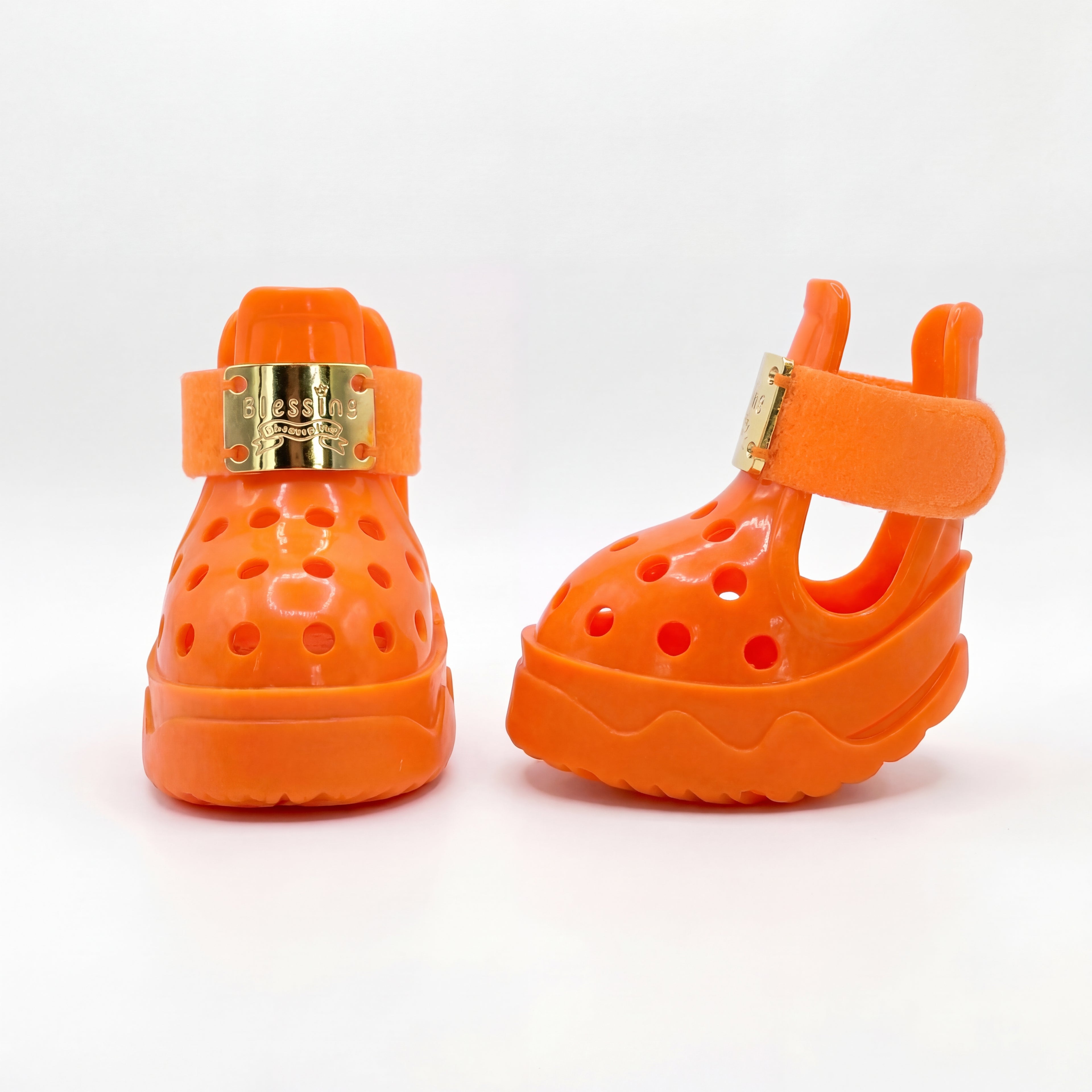 Side and rear angle of a pair of Blessingmychild V1 luxury orange dog shoes highlighting the secure ankle straps and breathable design