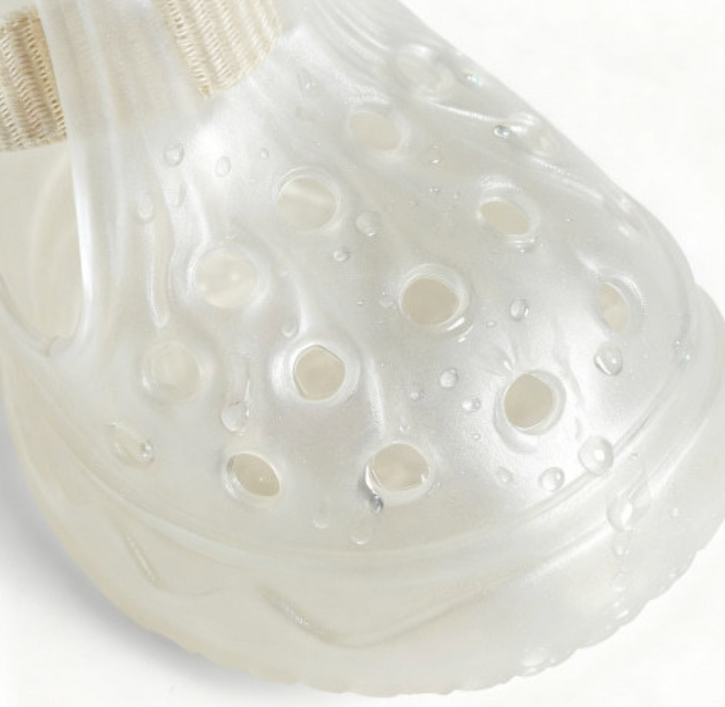 Macro extreme closeup of water droplets on Blessingmychild V1 classic pearl white dog shoe showcasing its premium waterproof material and breathable ventilation holes