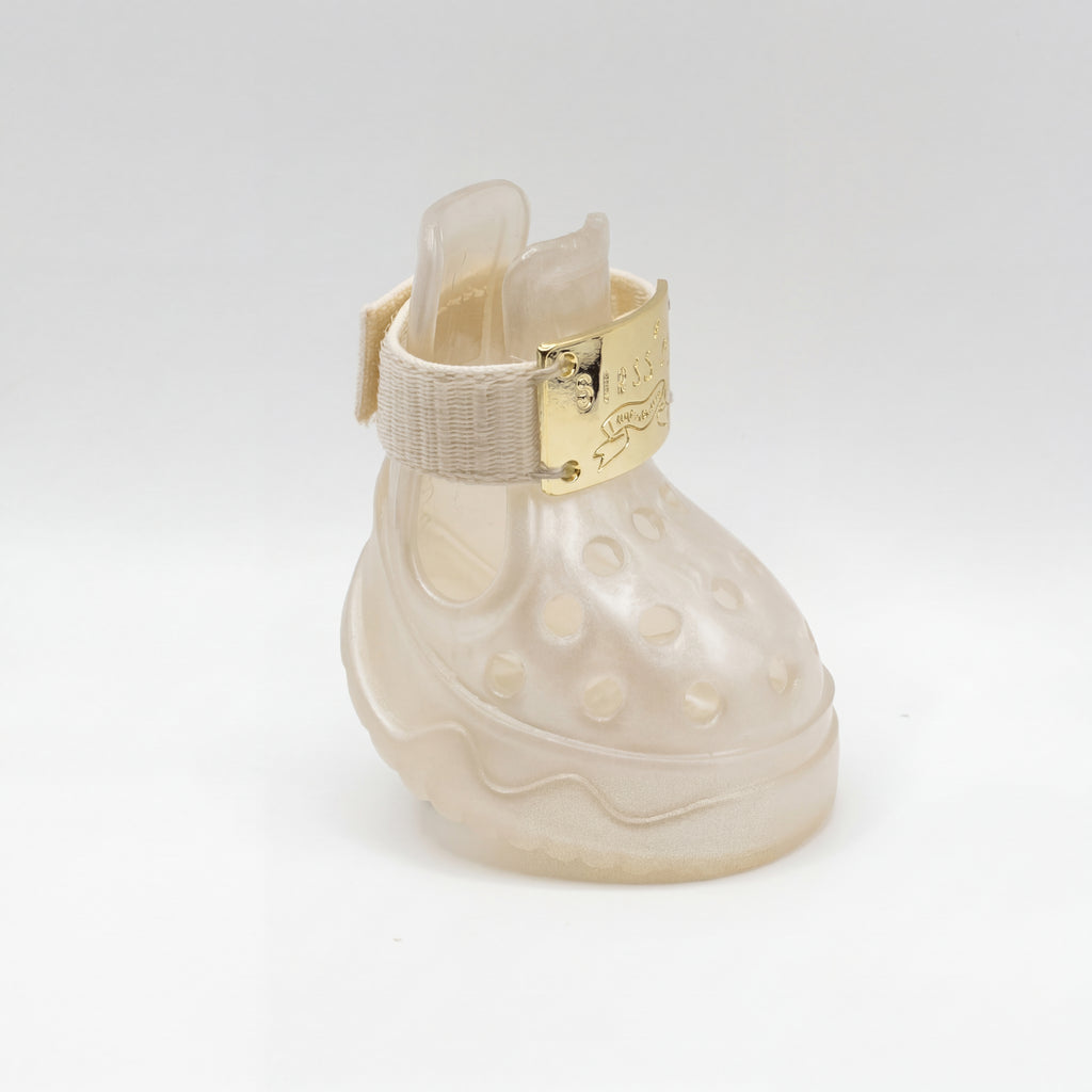 Clean side profile view of a Blessingmychild V1 limited edition white-moonlight dog shoe with premium gold hardware