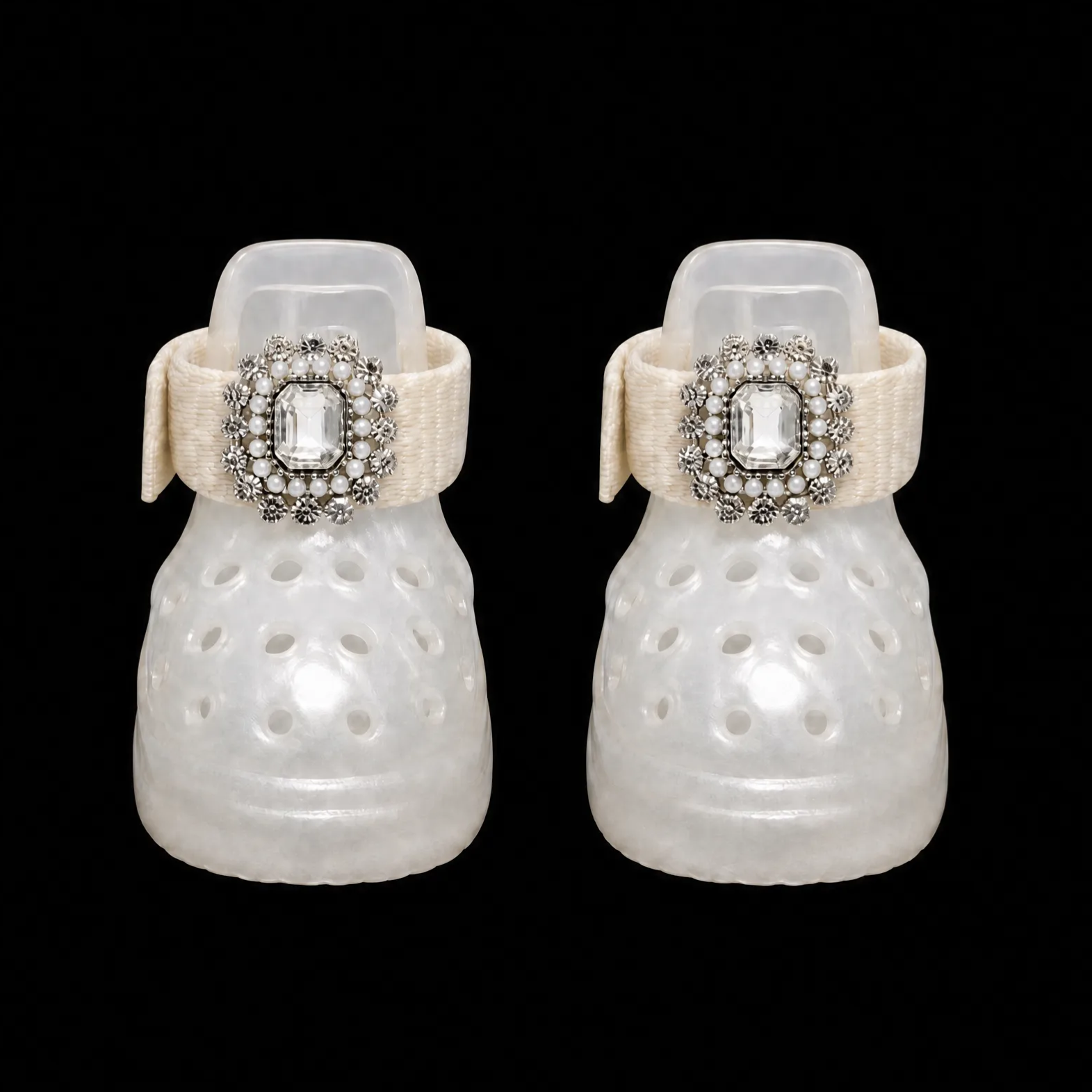 A pair of Blessingmychild elegant white jelly dog shoes adorned with oversized crystal and lustrous pearl crown brooches