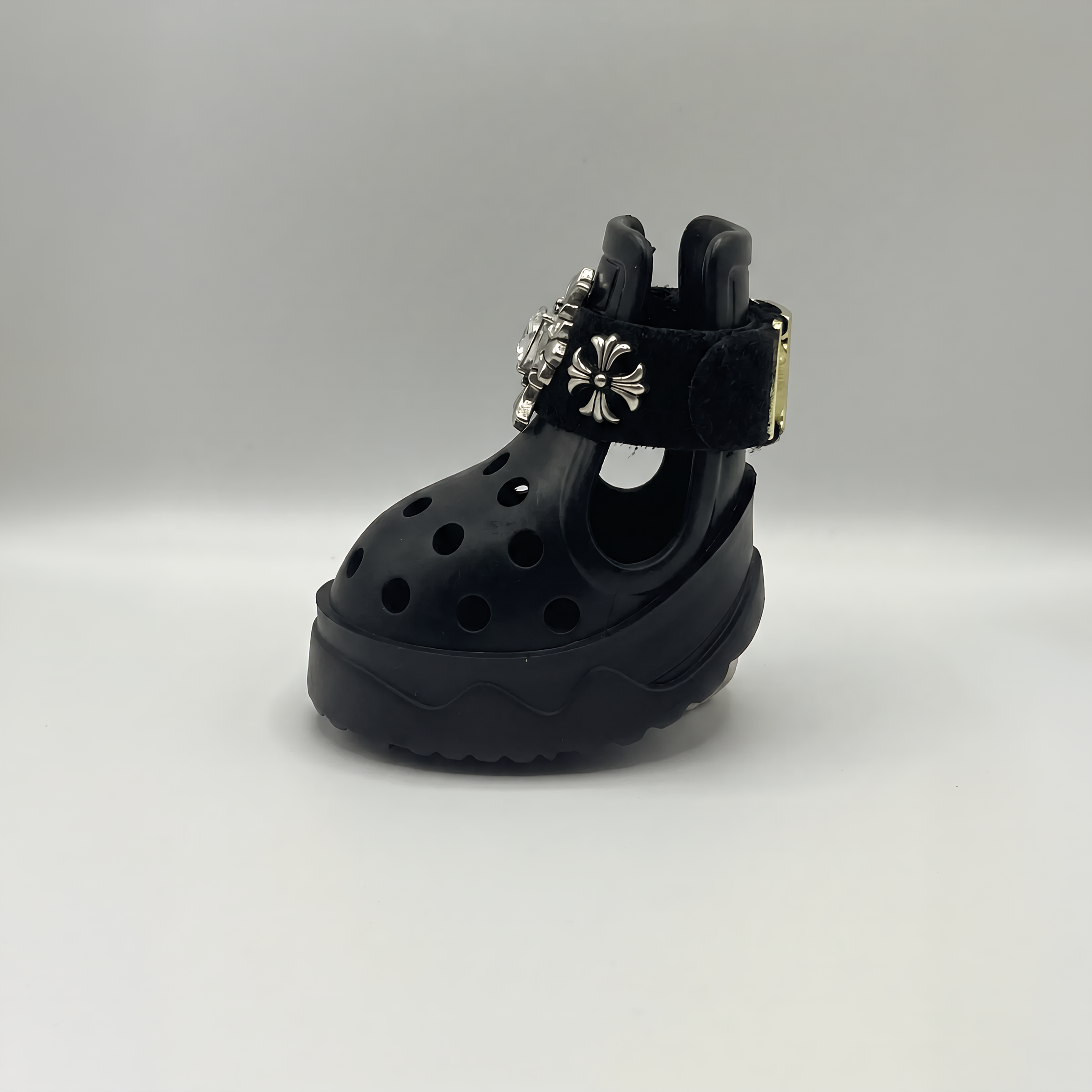 Close-up side profile of BLESSING protective dog sandal, highlighting the adjustable strap and premium gold buckle hardware.